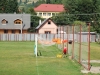 Čiernohronská železnica, domorodkyňa na futbalovej bráne v Dobroči suší bielizeň